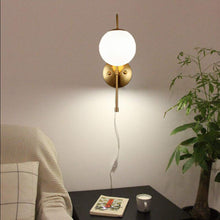 Load image into Gallery viewer, Mid-Century Globe Sully Warm Brass Plug-in Wall Lamp